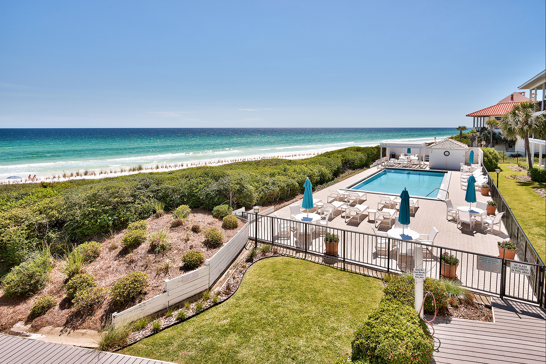 A Gulf front view from one of the landscaped lawns in Dune Allen and neighboring swimming pool